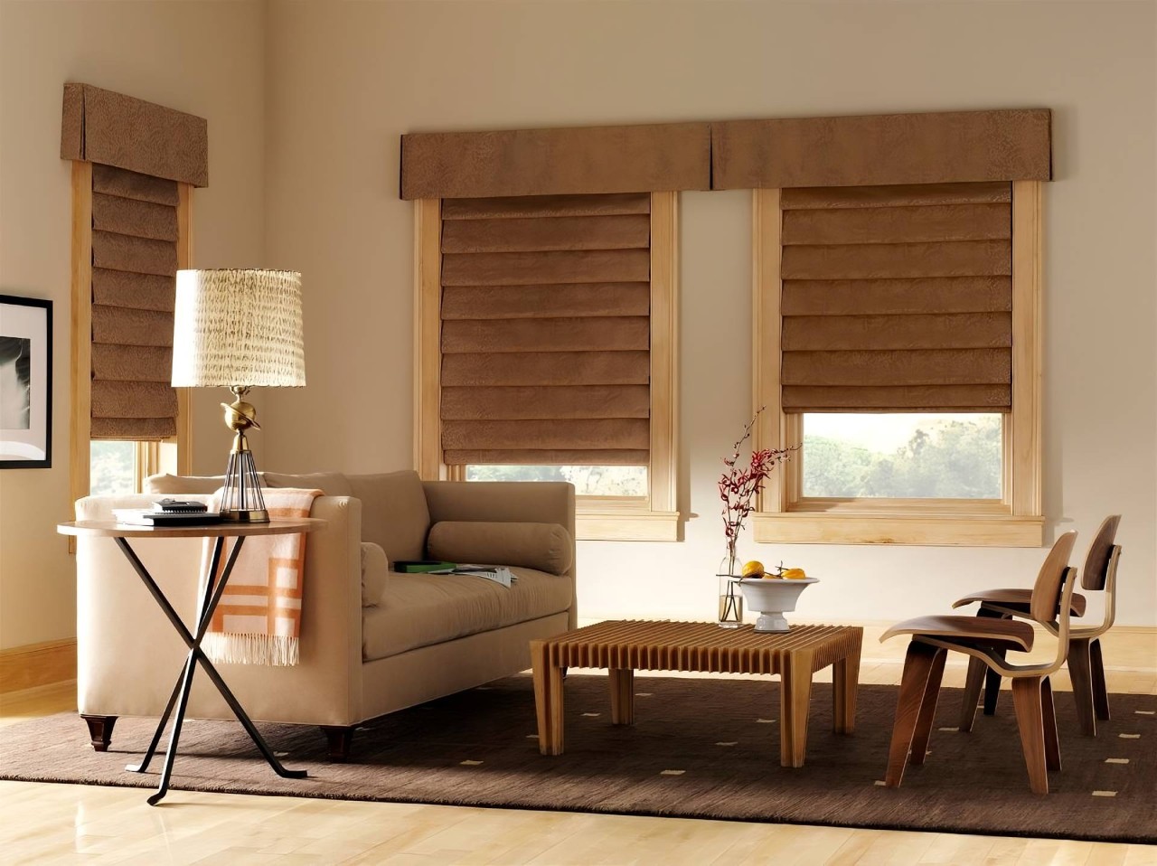 A formally decorated living room with Design Studio™ Roman Shades on the windows near Bloomington, IL